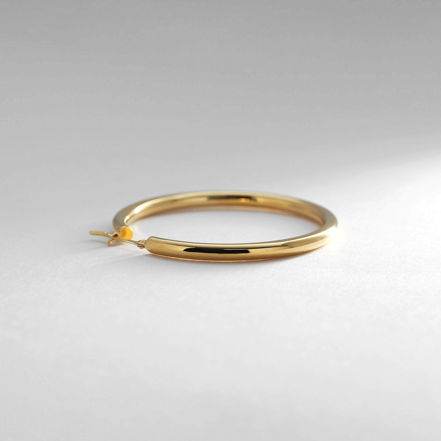 COCOSHNIK ONKITSCH「シルバー ホロウ フープピアスL GP」|ピアス|