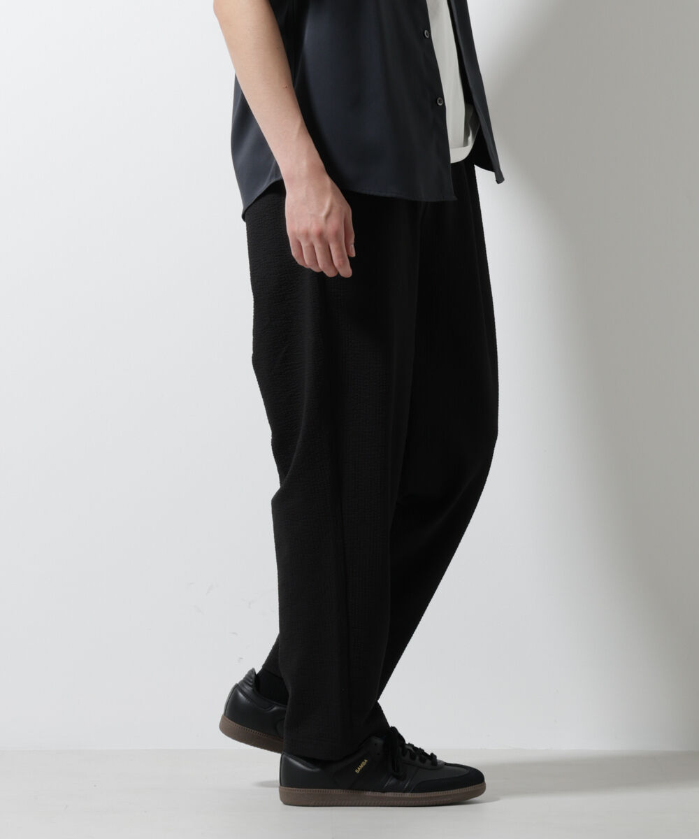 nano･universe「ジャージーサッカーワイドテーパードパンツ」|チノ|ブラック