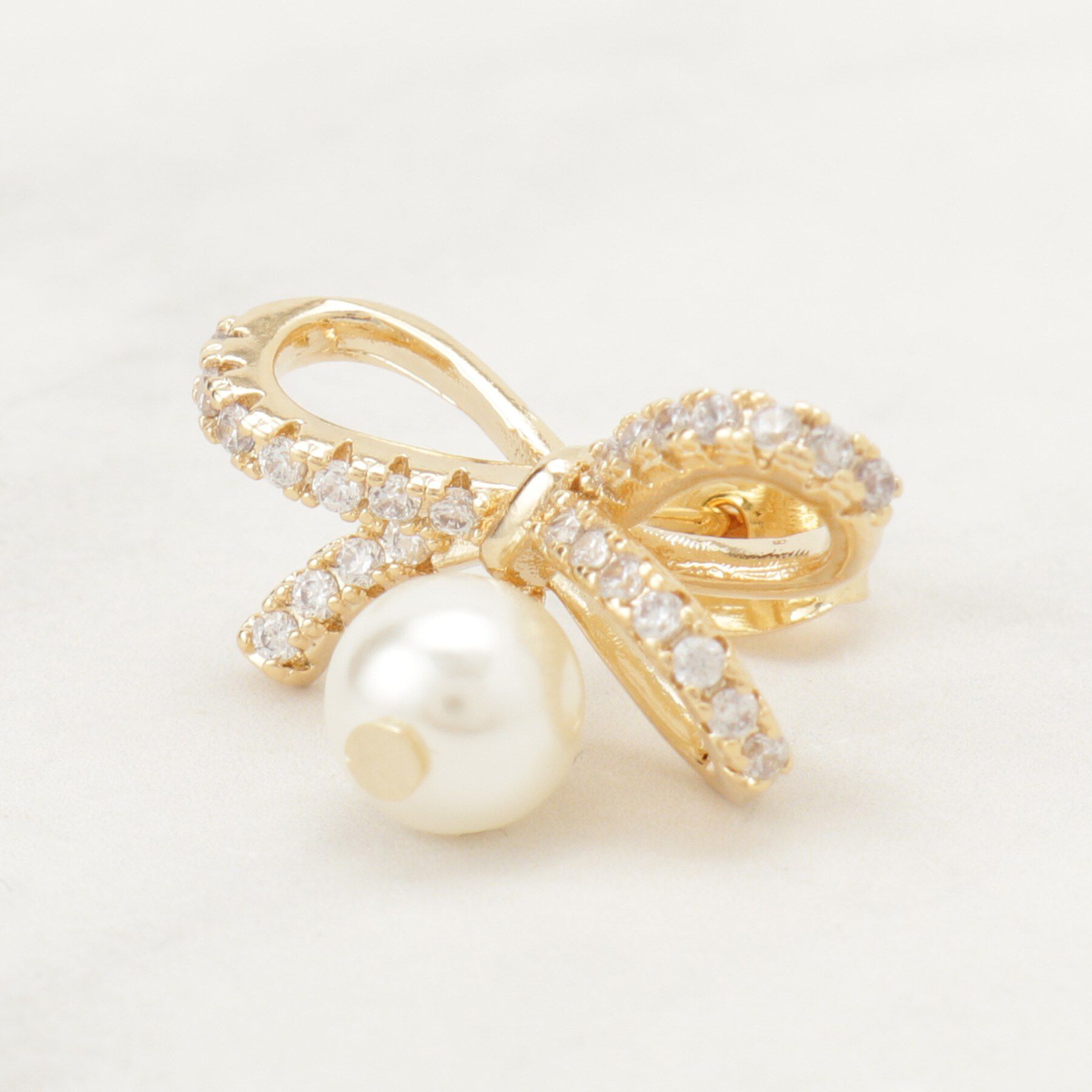 Couture broach「ビジューリボンパール調ピアス」|ピアス|