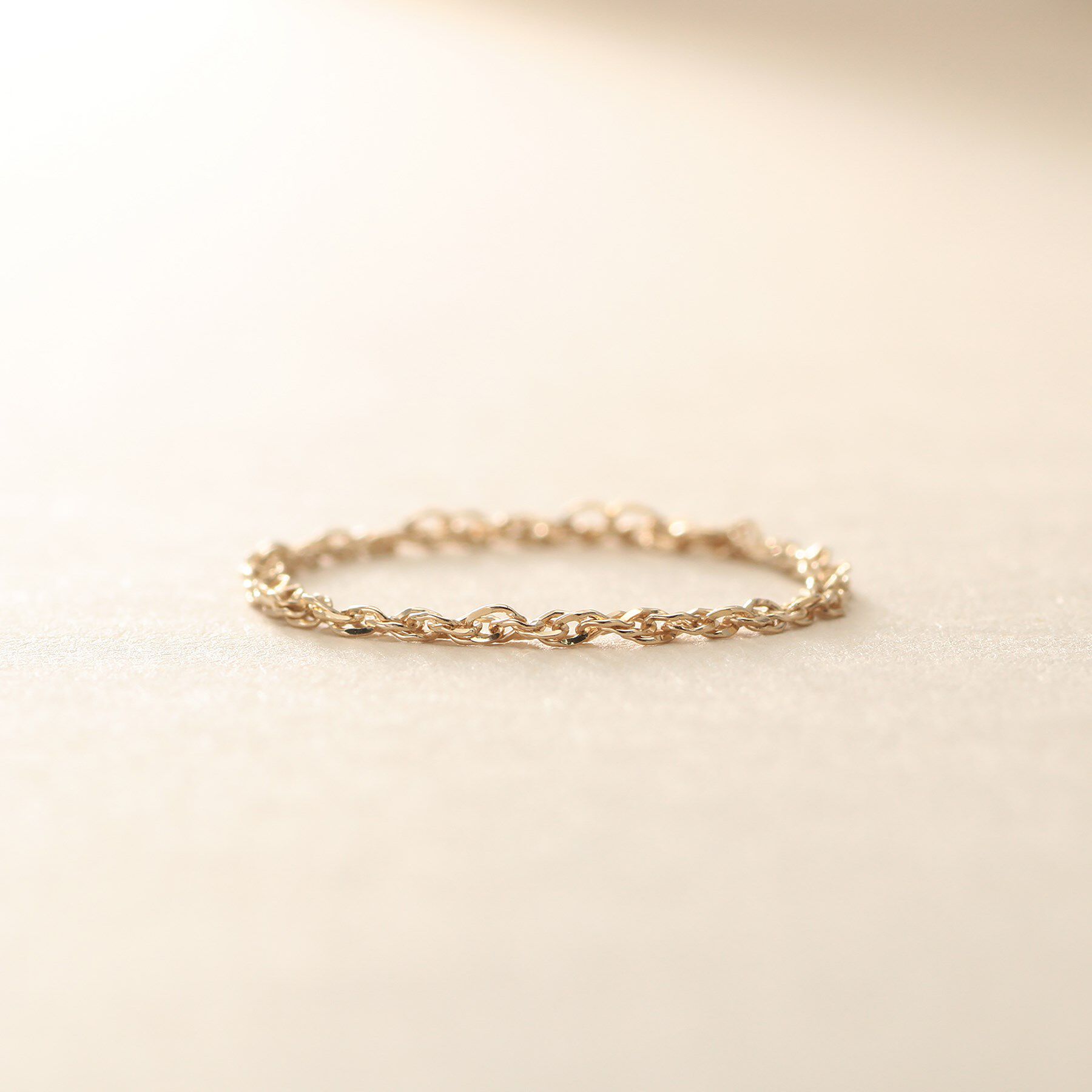 COCOSHNIK ONKITSCH「K10スキニーリング スクリューチェーン」|リング|