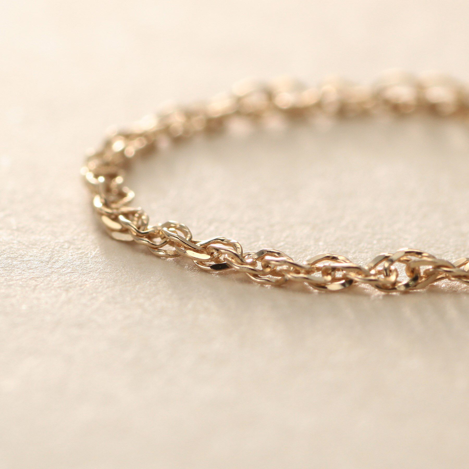 COCOSHNIK ONKITSCH「K10スキニーリング スクリューチェーン」|リング|