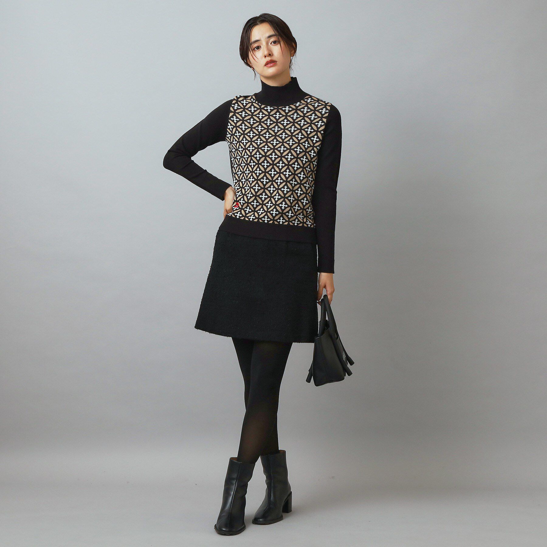 DRESSTERIOR「オーバーラップサークルタートルネック」|ニット・セーター|