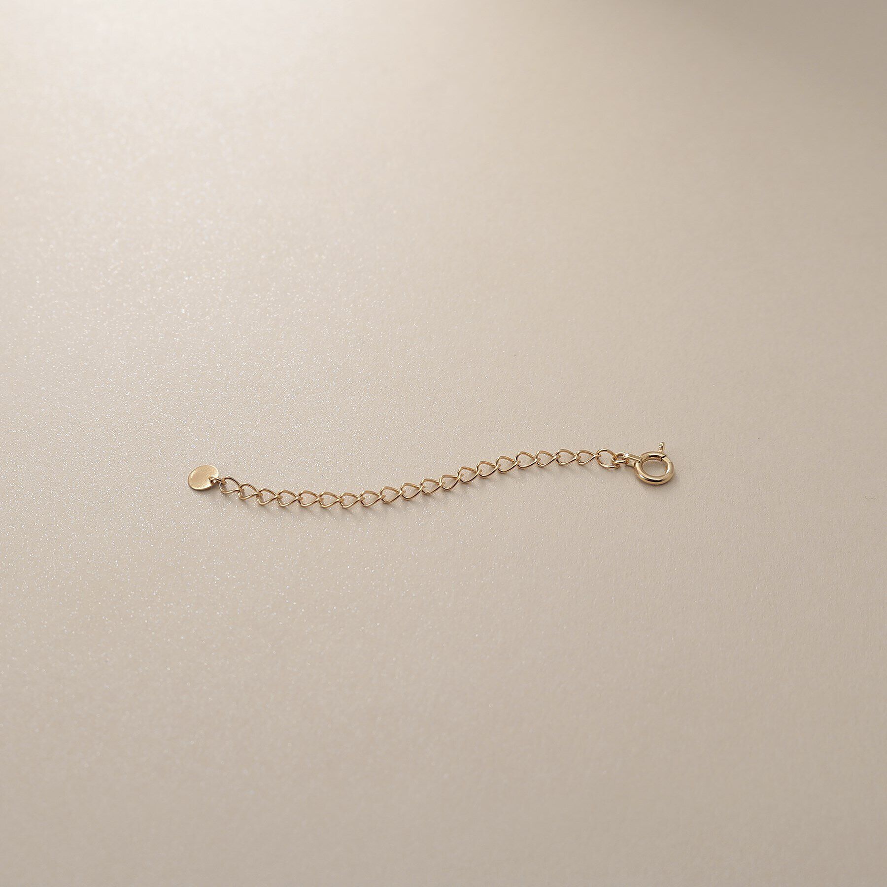 COCOSHNIK「K18ラウンドプレート アジャスター」|イヤーカフ|