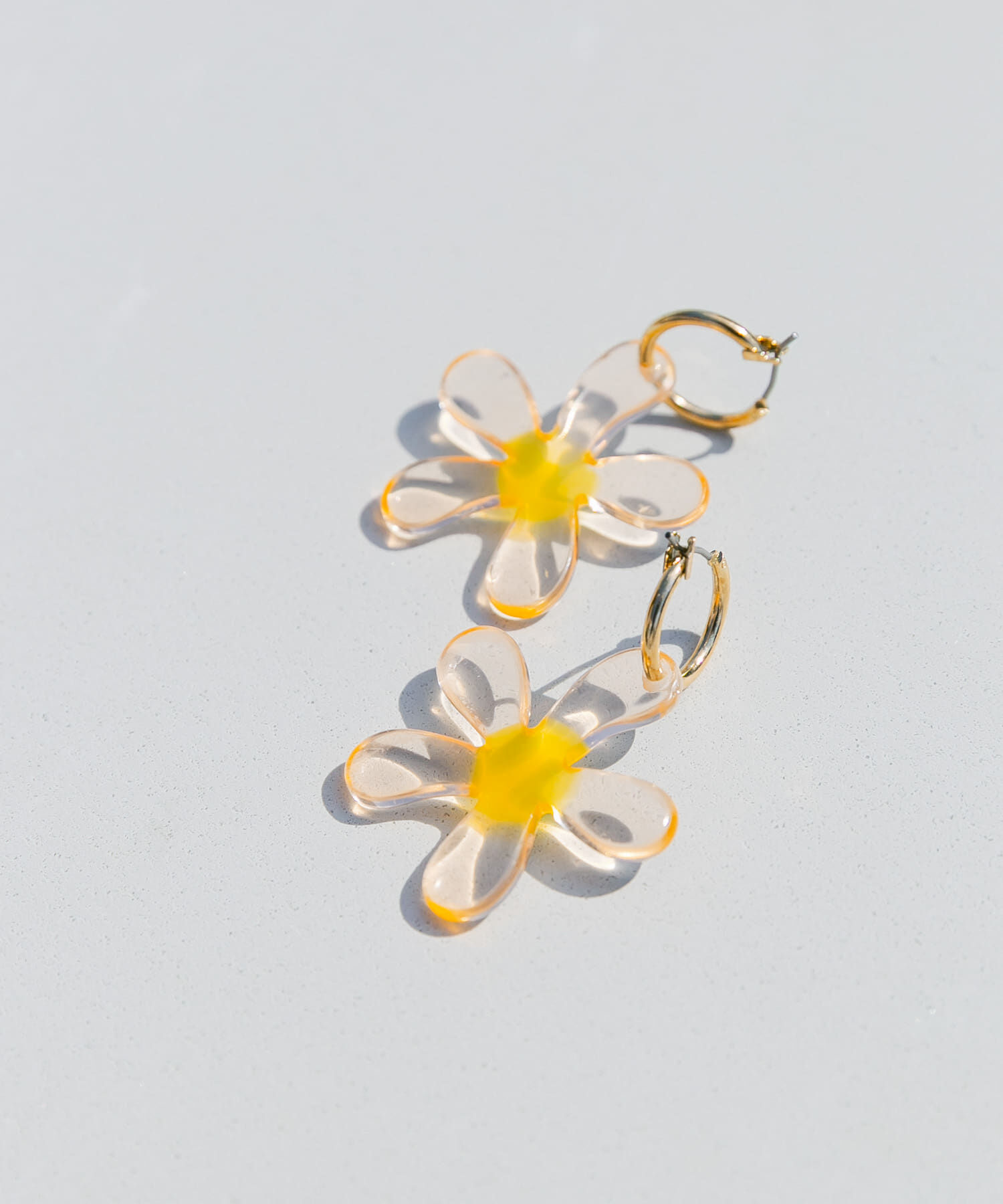 SMELLY「クリアフラワーメタルフープピアス」|ピアス|