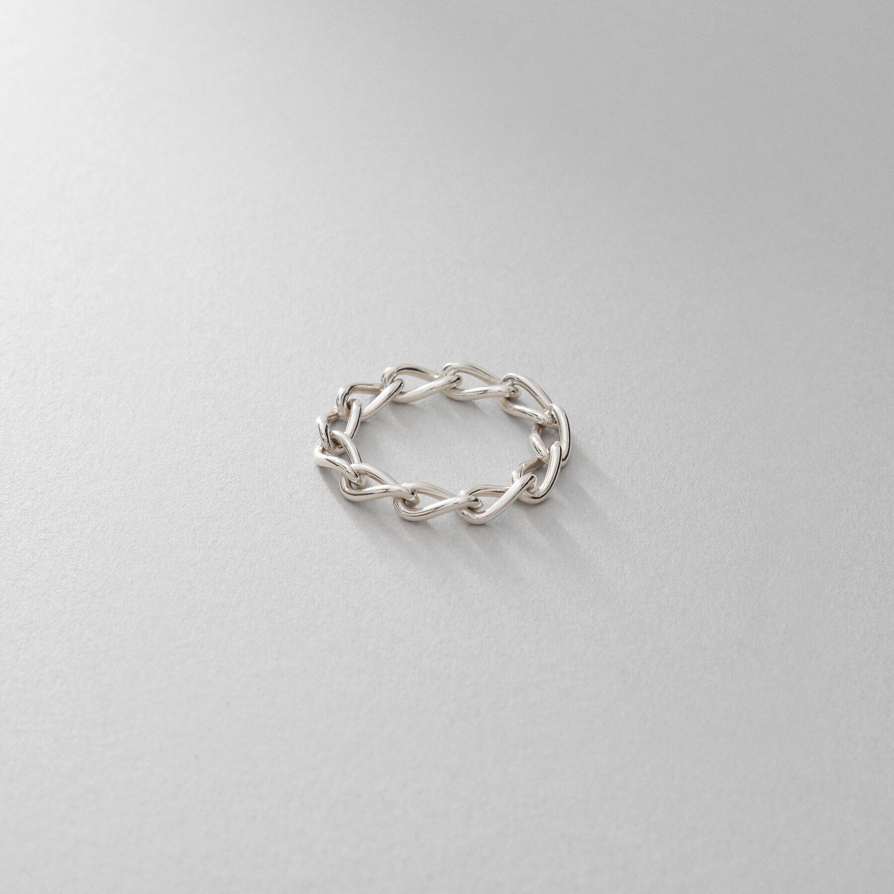 COCOSHNIK ONKITSCH「シルバー チェーンリング ロングカーブ」|リング|