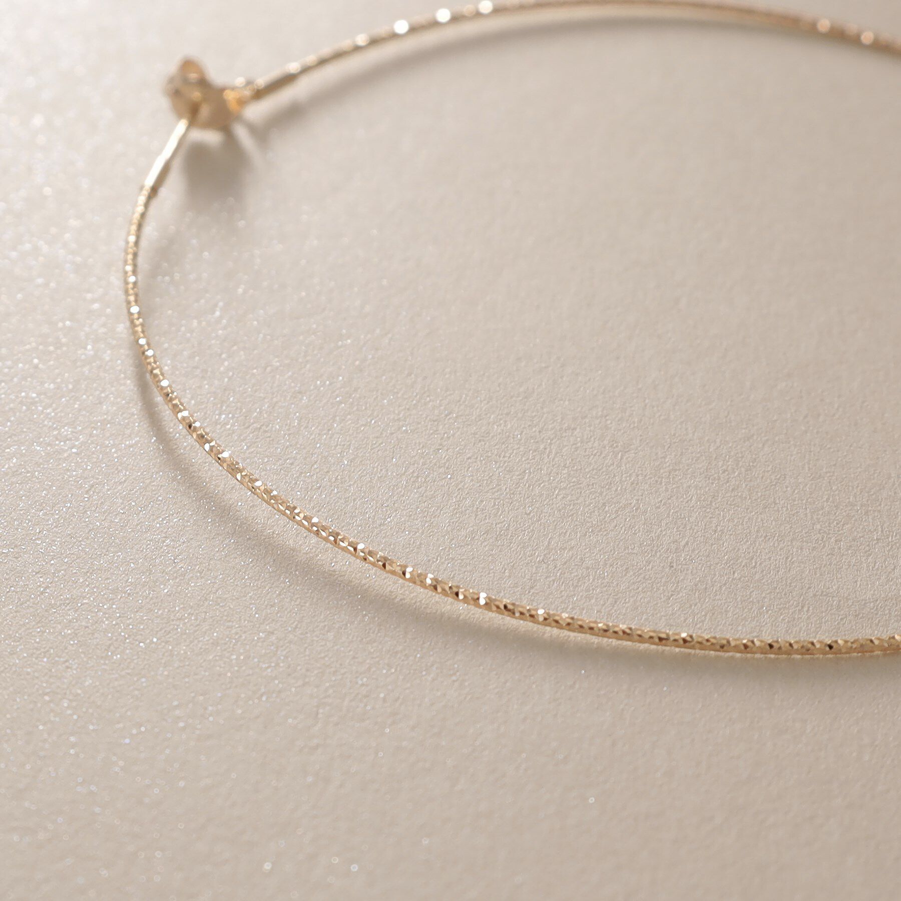 COCOSHNIK「K10カット丸線 フープピアス（大）」|ピアス|