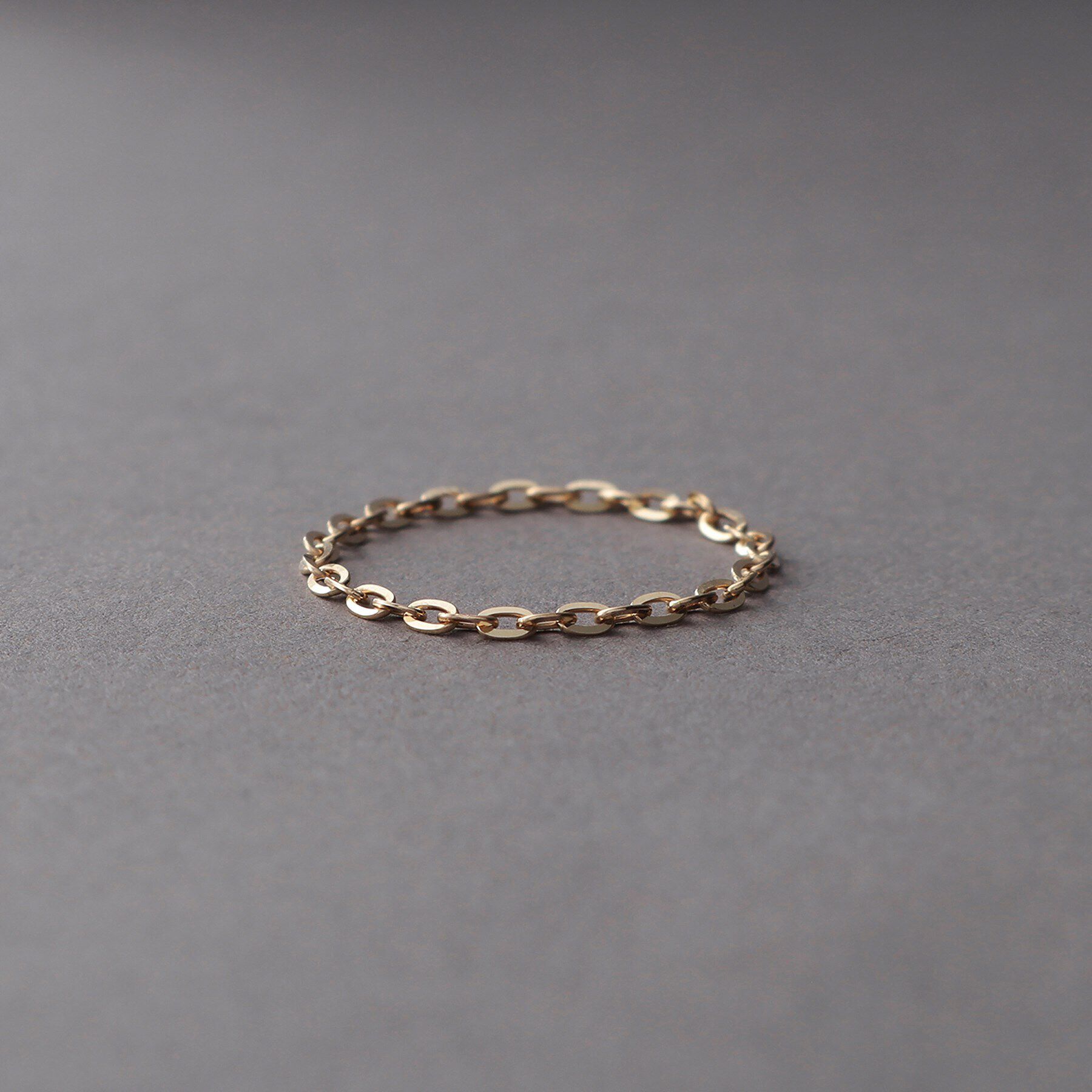 COCOSHNIK ONKITSCH「K10スキニーリング フラッシュケーブル」|リング|