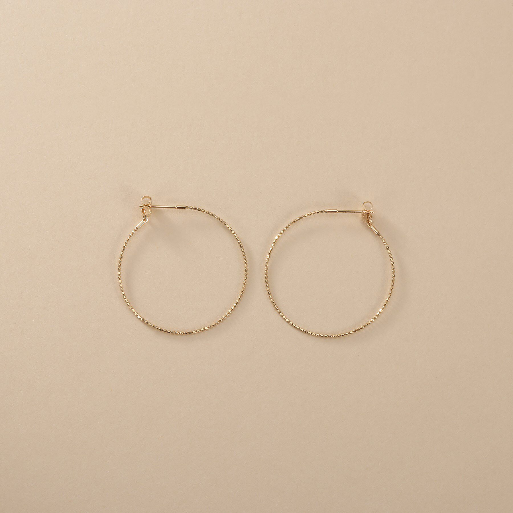 COCOSHNIK ONKITSCH「K10カットボールフープピアス」|ピアス|