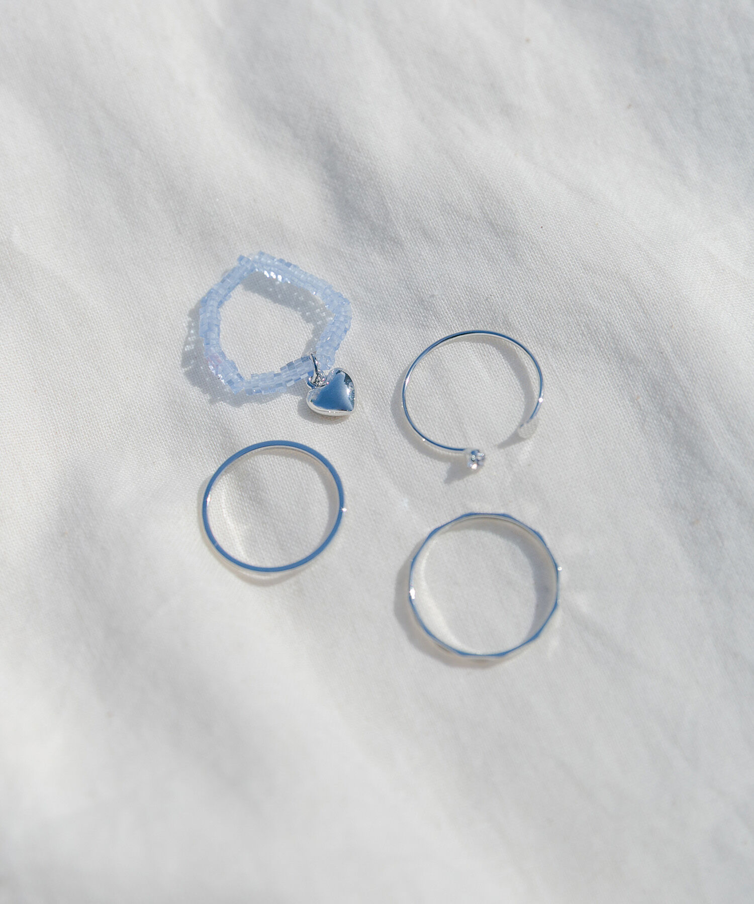 SMELLY「チャームビーズ4セットリング」|リング|ブルー系その他