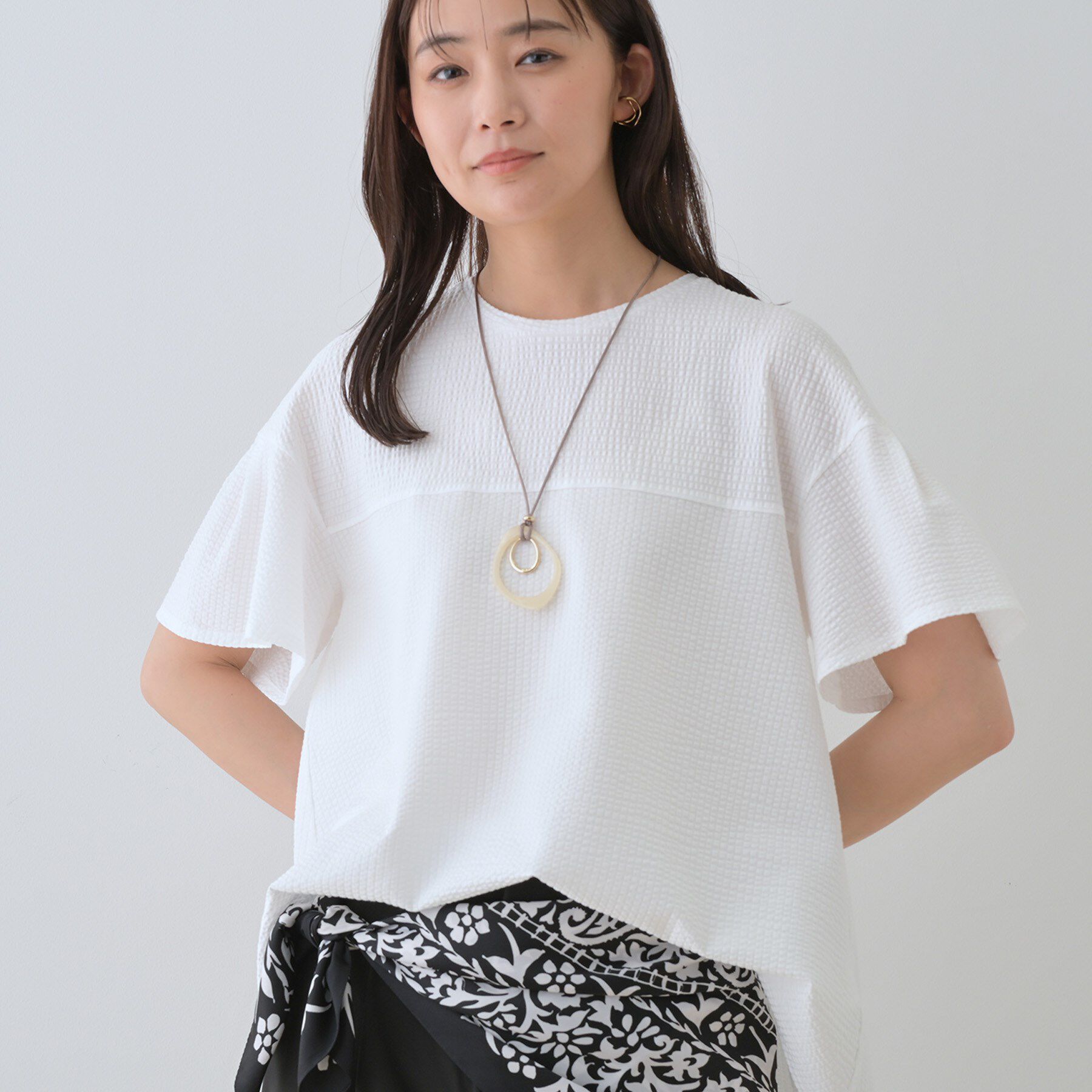 INDIVI「【洗える／体型カバー】凹凸素材フレアデザイントップス」|Tシャツ・カットソー|