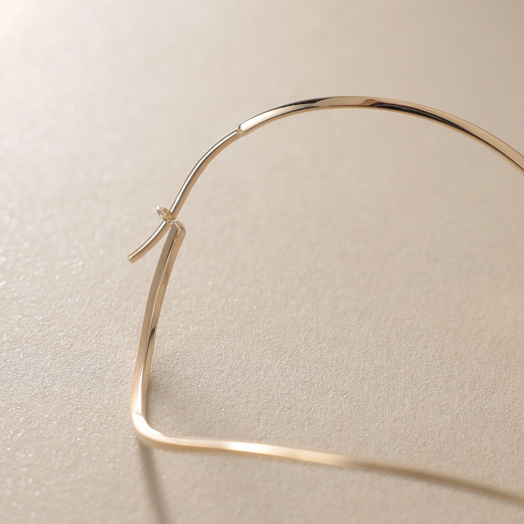 COCOSHNIK「K10ポリッシュ 変形フープピアスL」|ピアス|