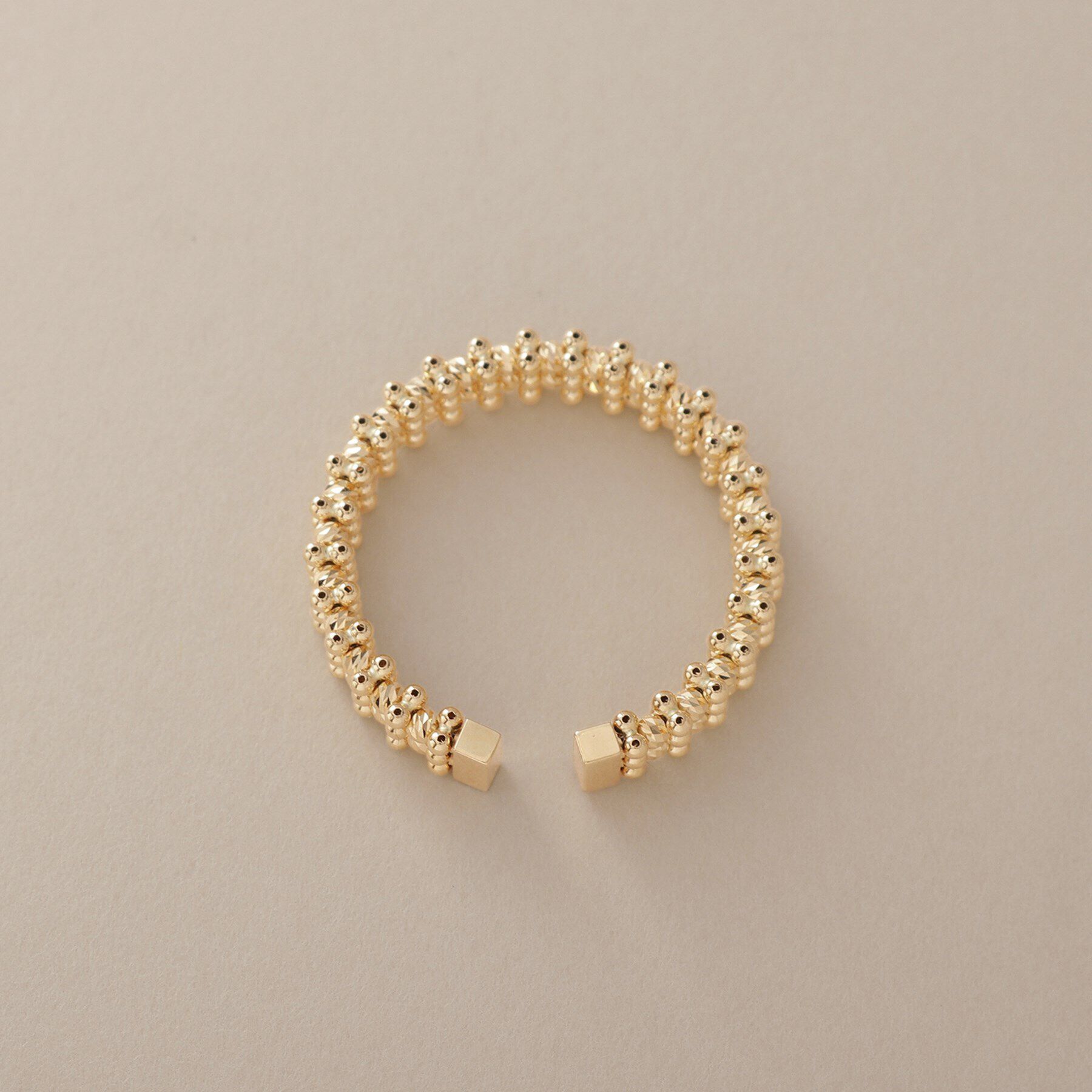 COCOSHNIK「K18ハニーカットボールオープン リング細」|リング|