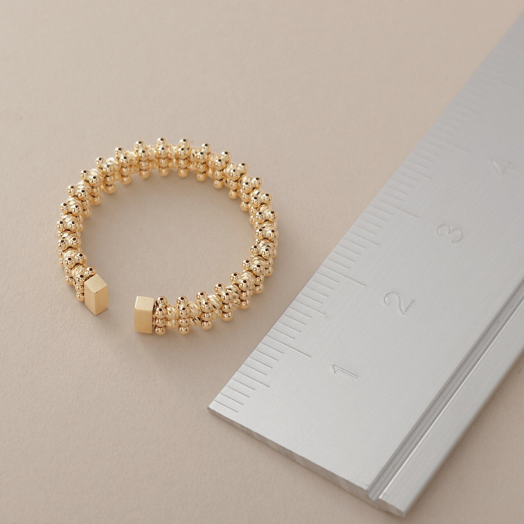 COCOSHNIK「K18ハニーカットボールオープン リング細」|リング|