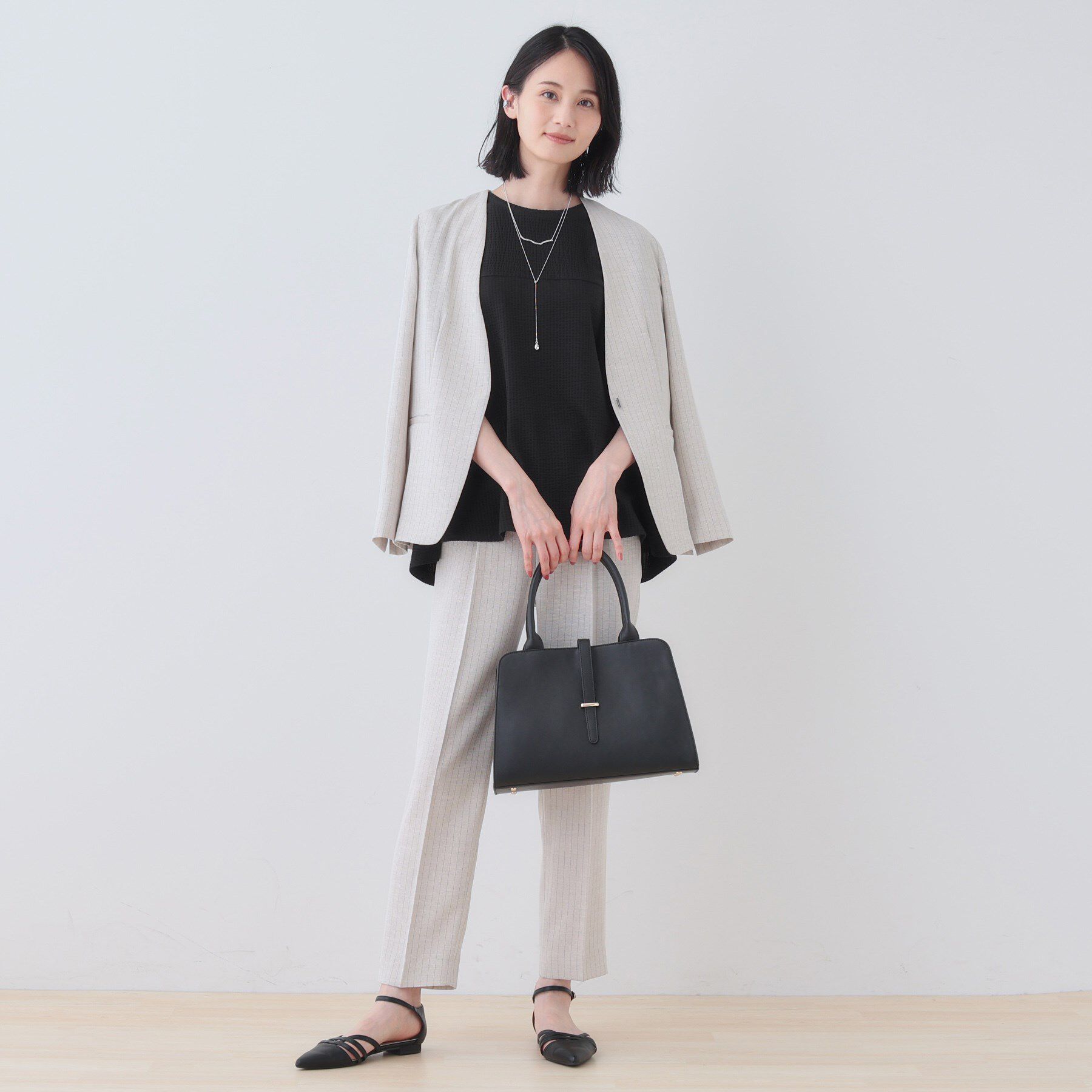 INDIVI「【洗える／体型カバー】凹凸素材フレアデザイントップス」|Tシャツ・カットソー|