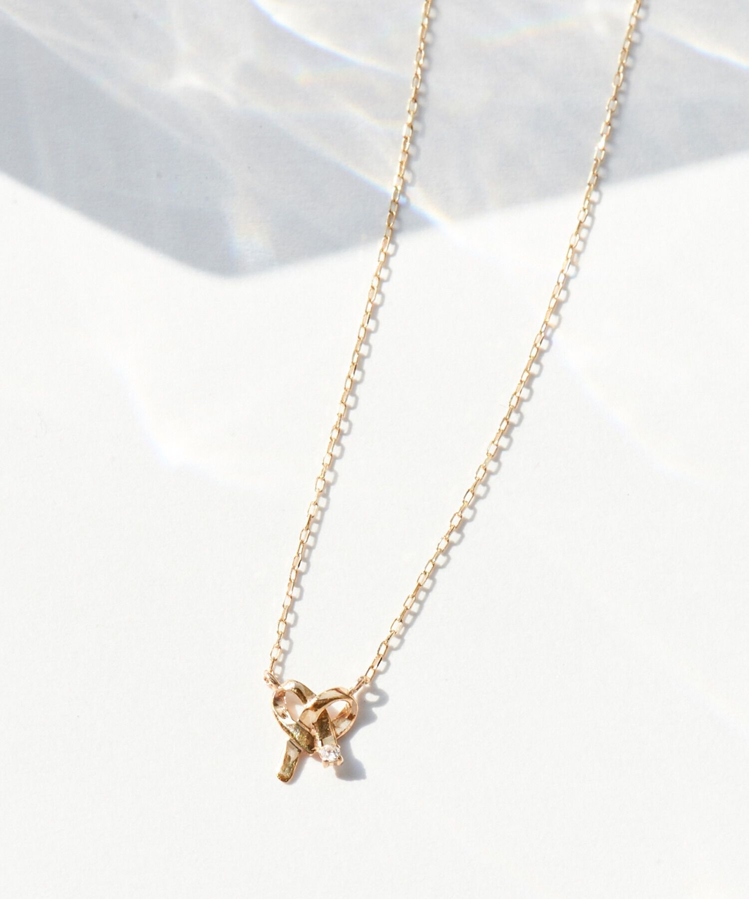 JUPITER「【K10】リボンモチーフダイヤモンドネックレス＜全長約40.5cm(調節した時の長さ37㎝)>」|ネックレス|