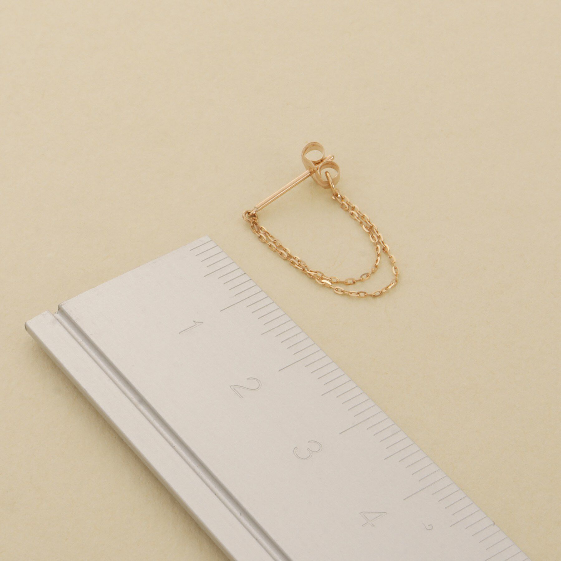 COCOSHNIK ONKITSCH「K10ミラーカットチェーン ドレープフープピアス」|ピアス|