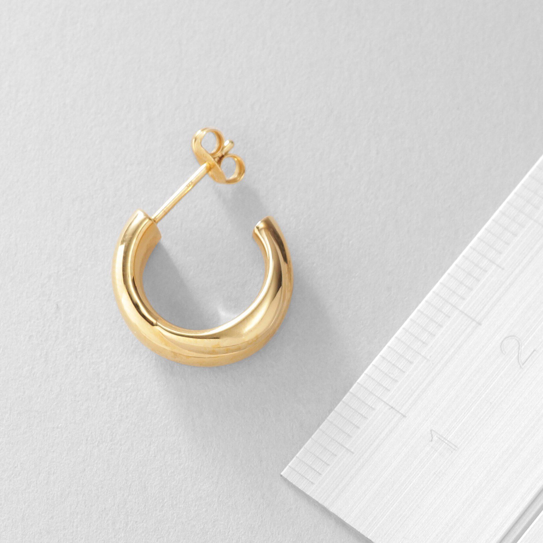 COCOSHNIK ONKITSCH「シルバー スモールフープ プランプクロスピアス GP」|ピアス|