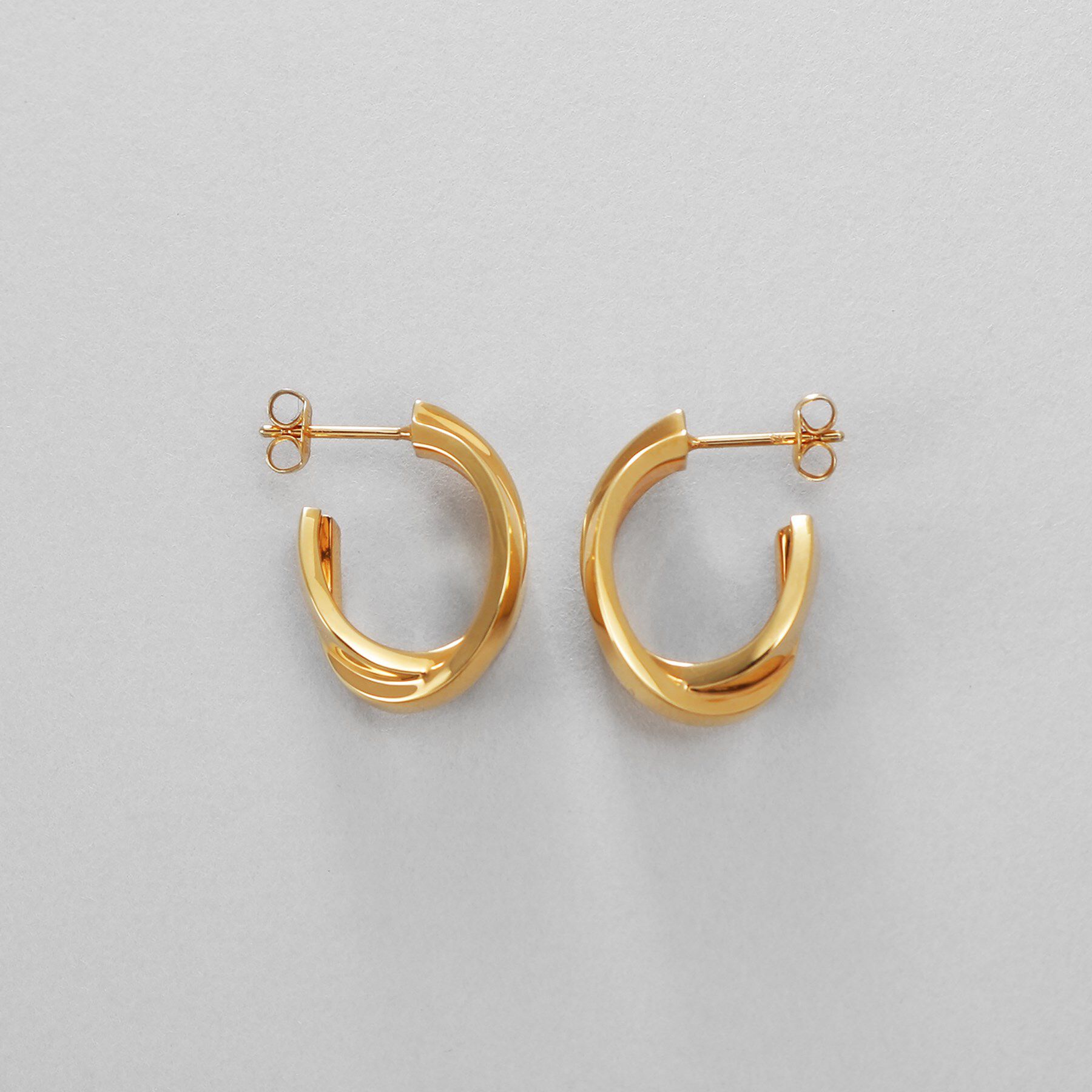 COCOSHNIK ONKITSCH「シルバー フラットオーバルクロスピアス GP」|ピアス|