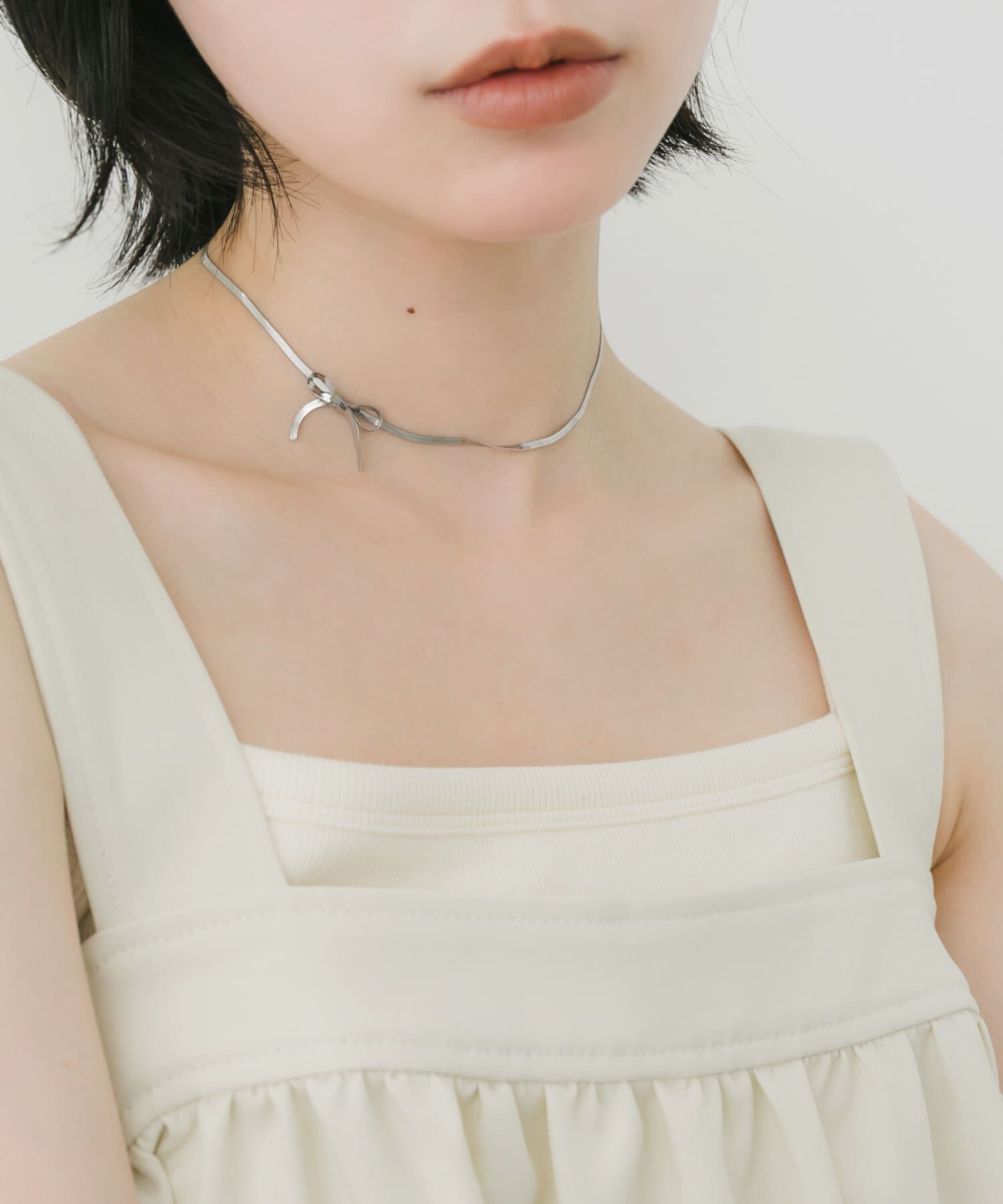 SMELLY「ステンレススネークチェーンリボンネックレス」|ネックレス|