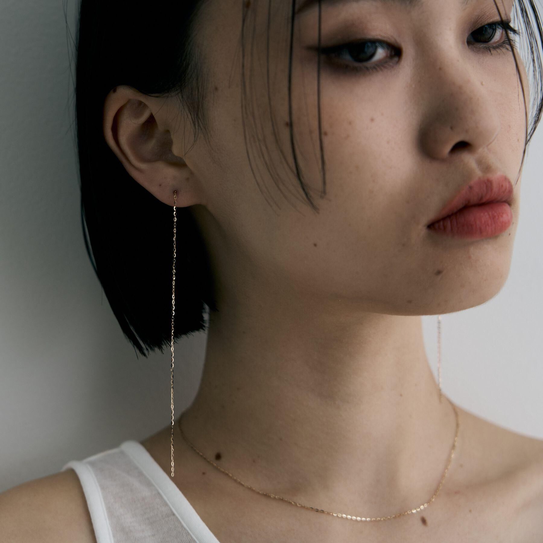 COCOSHNIK ONKITSCH「K10チェーンピアス フラッシュケーブル」|ピアス|