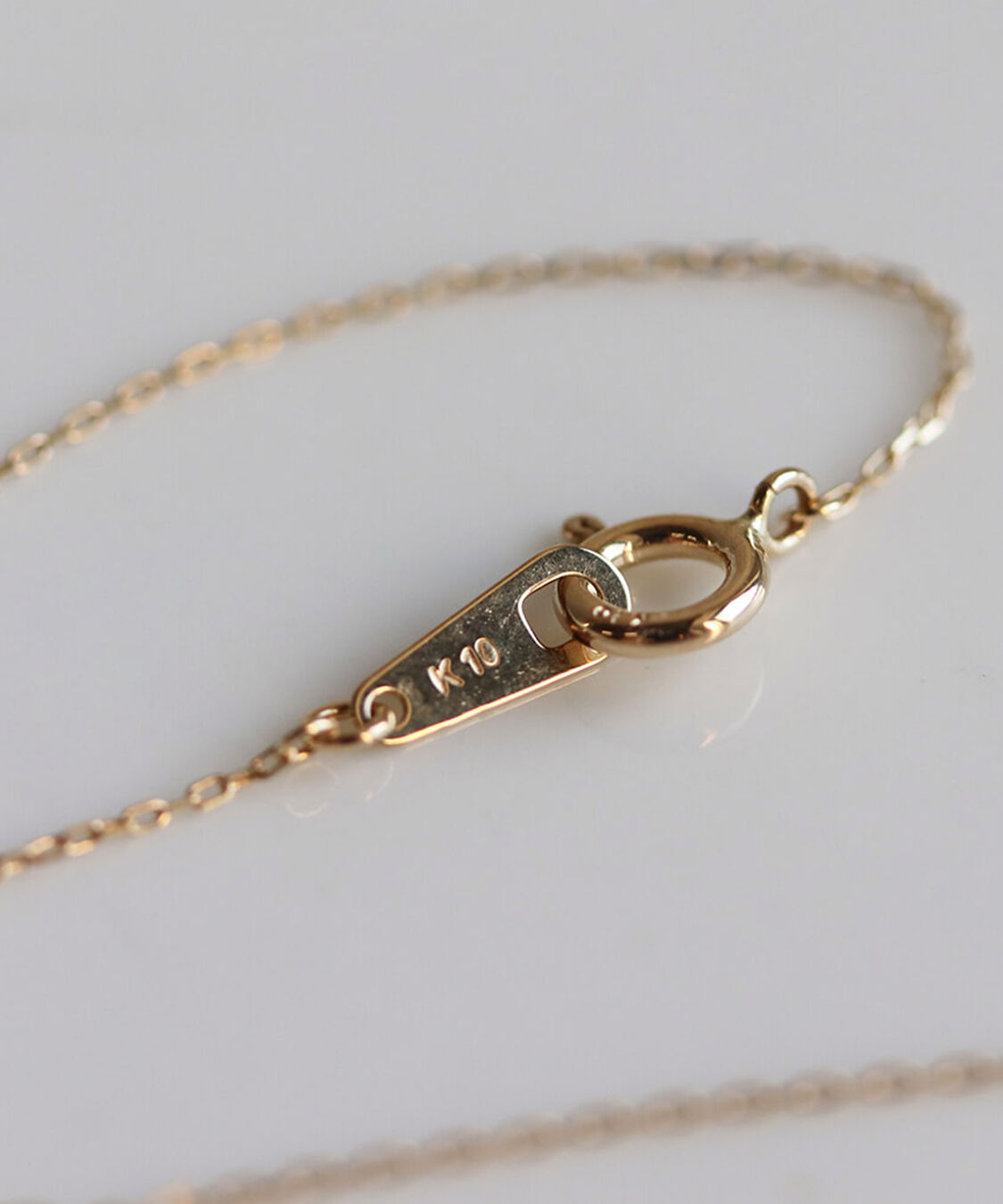 「1石 シャンパンダイヤモンド 0.1ct ムーブチェーン ネックレス | K10YG 〈ヌーディー〉」|ネックレス|