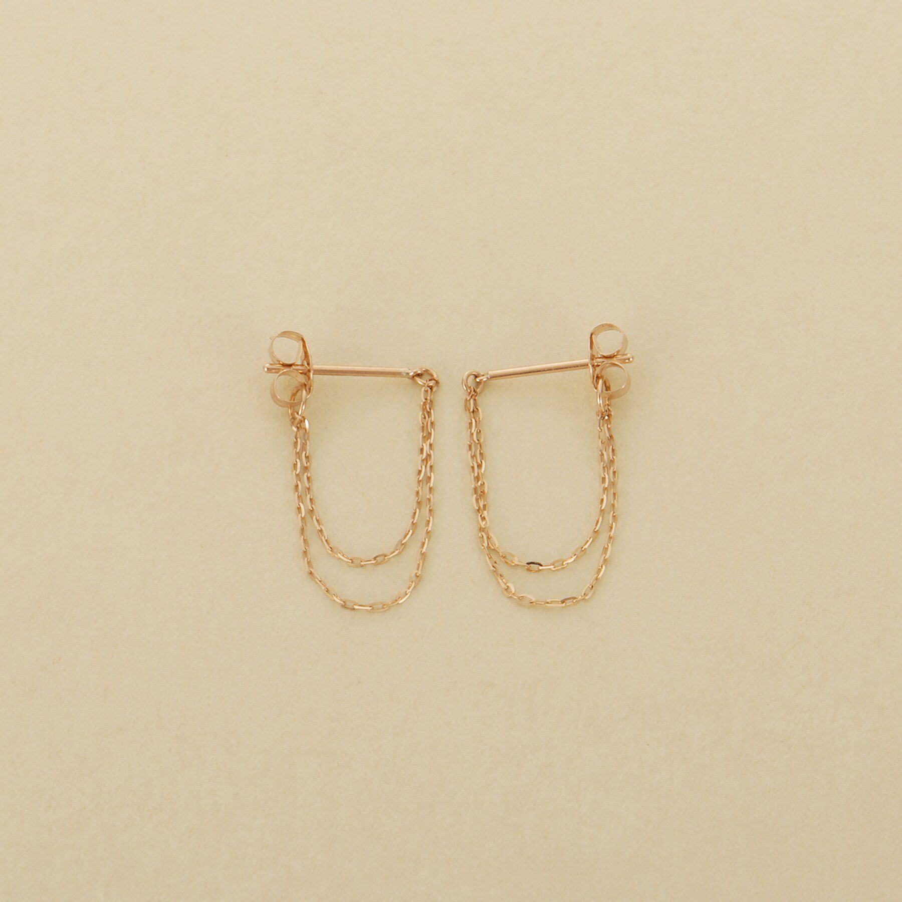 COCOSHNIK ONKITSCH「K10ミラーカットチェーン ドレープフープピアス」|ピアス|