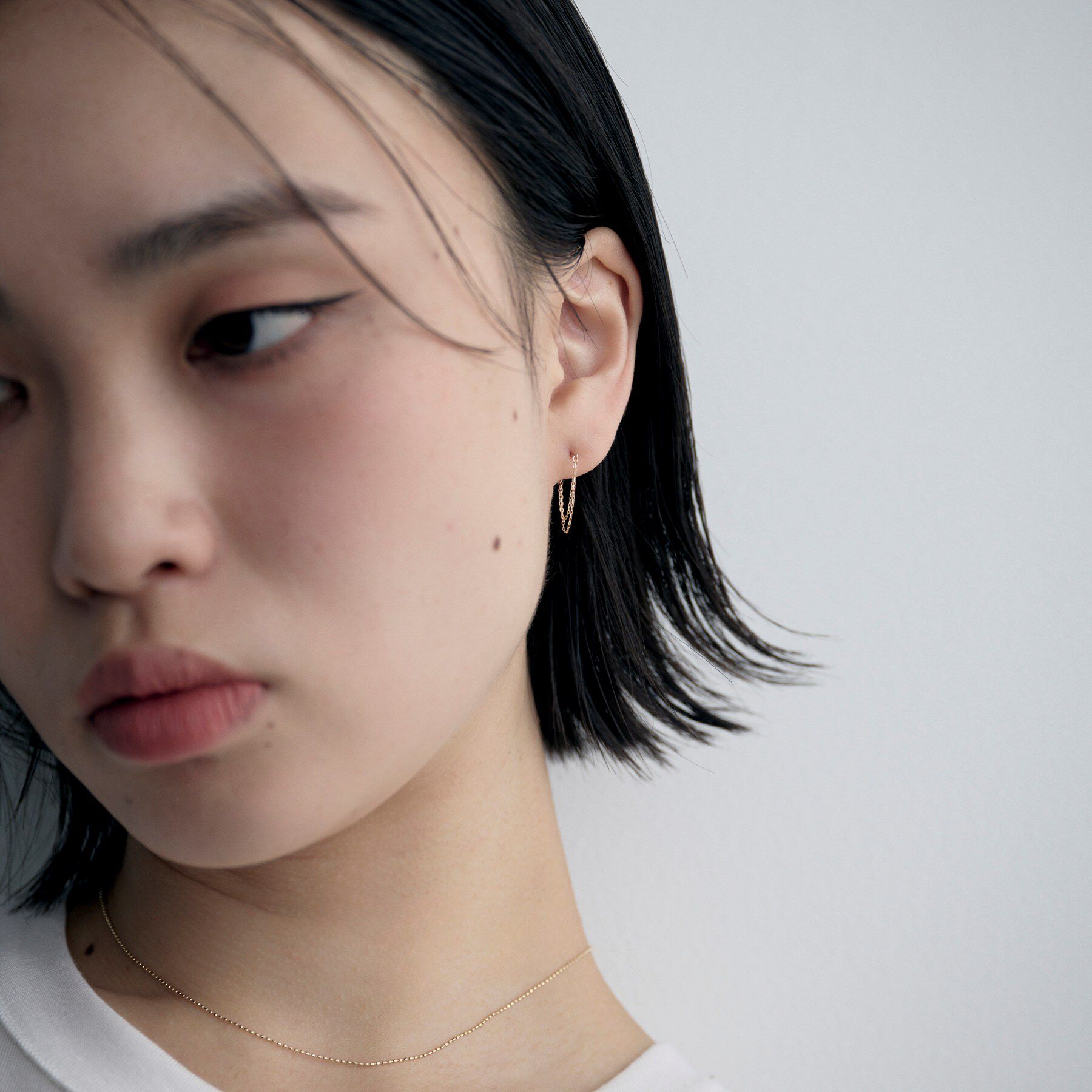 COCOSHNIK ONKITSCH「K10ミラーカットチェーン ドレープフープピアス」|ピアス|